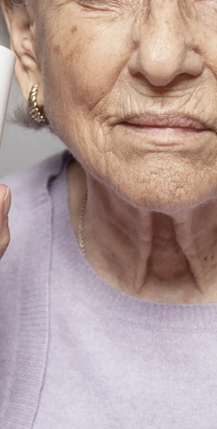 woman holding Curology bottle